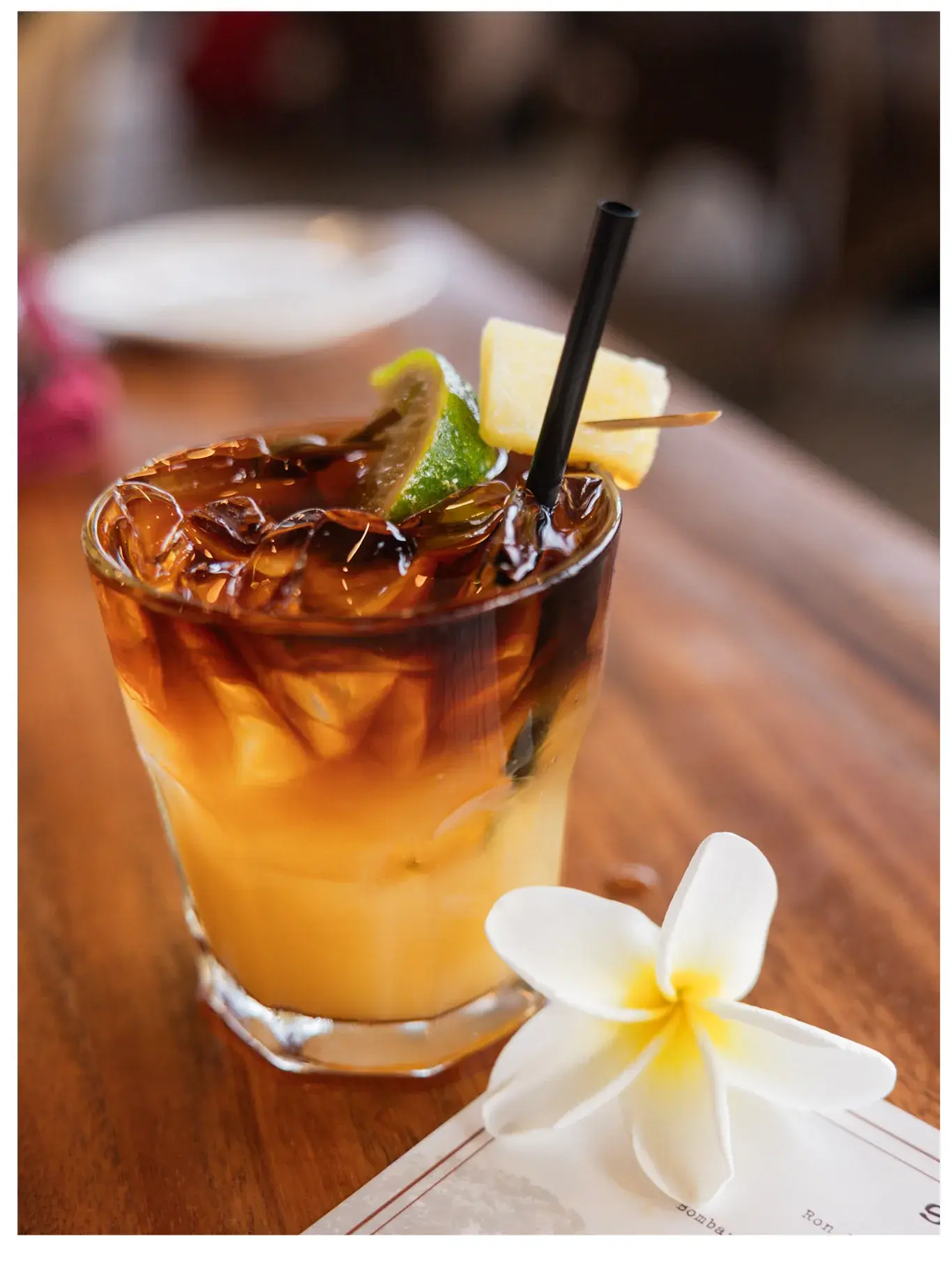 The Kona Inn Mai Tai, light rum and orgeat under the juices with a dark rum and 151 overproof float on top, garnished with lime and pineapple
