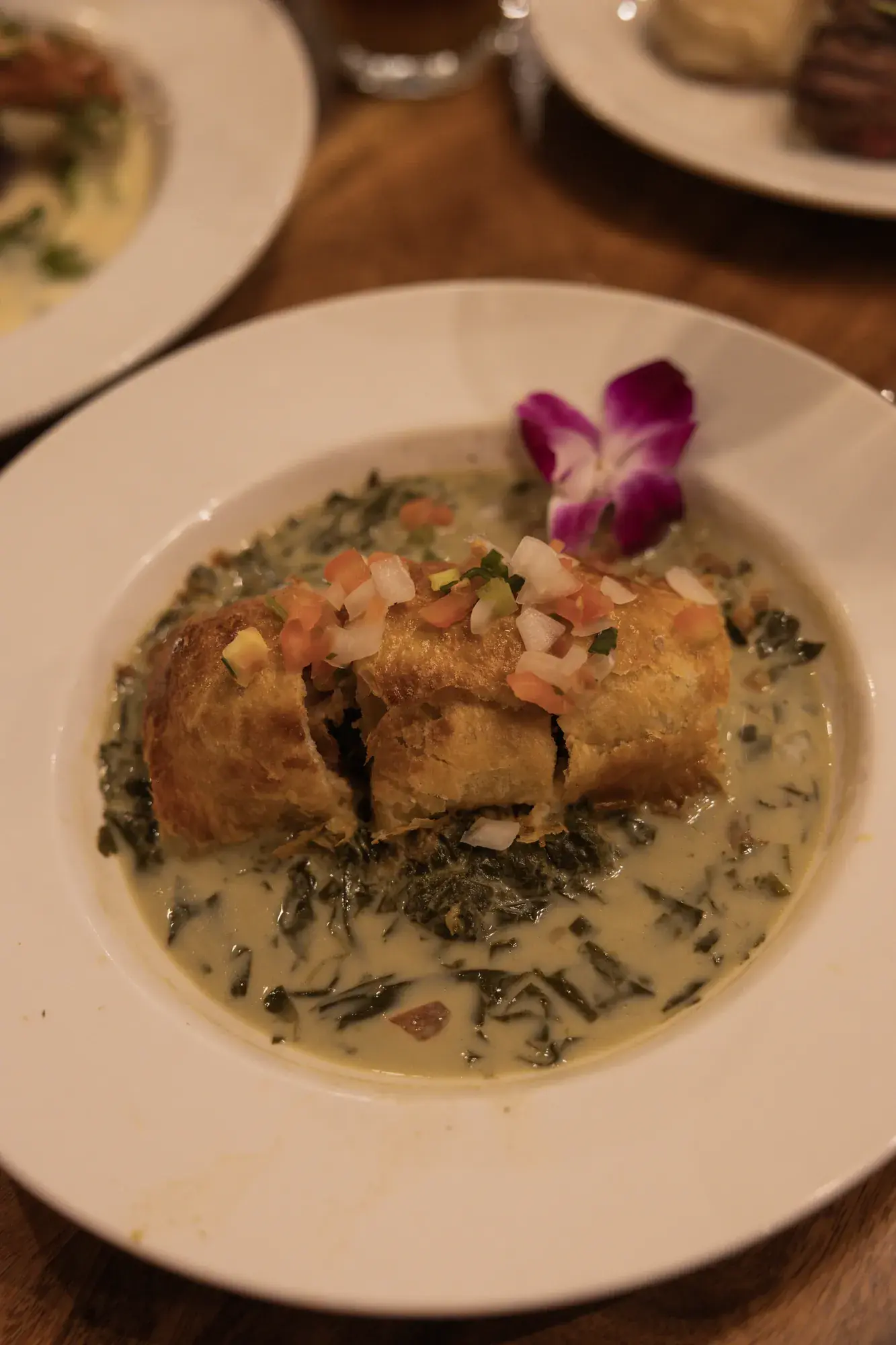 Pork Wellington at Kona Inn Restaurant with mushroom reduction, taro leaf, and coconut reduction